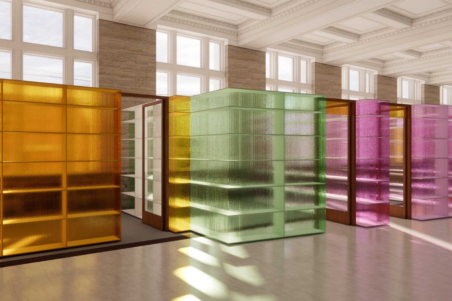 A long room lined with amber, green and pink translucent glass partitions